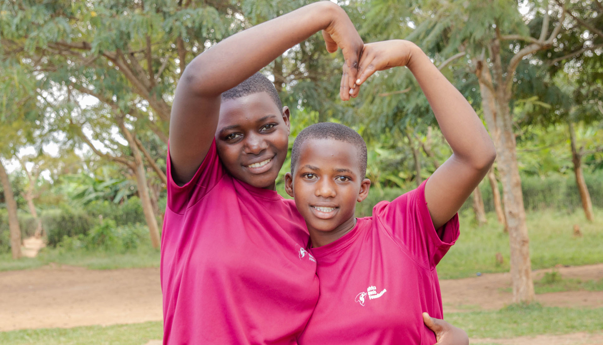Children making heart shape